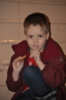 Lucas (6) eats a cookie at the Santa Train