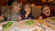 Isabella (7), Giuliana (1), and Lucas (6) enjoying Christmas Waffles at Twedes Cafe